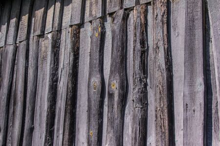 abstract background of old gray boards with a beautiful texture with knotsの写真素材