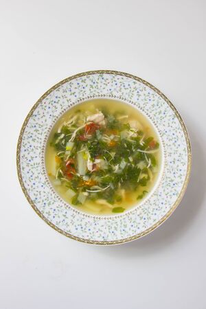 plate with classic Russian soup with herbs, top viewの写真素材