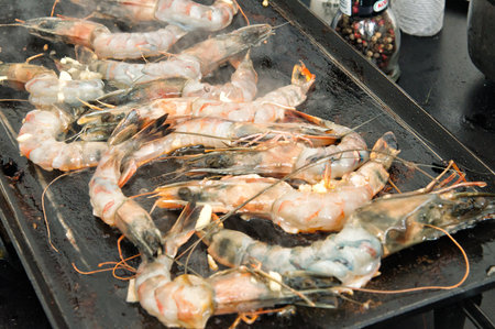 Fresh seafood shrimp prepared on the barbecue grillの写真素材