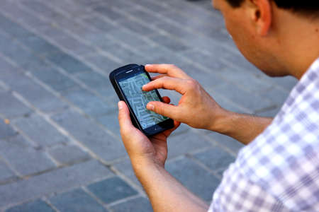 Man using navigation system travellingの写真素材