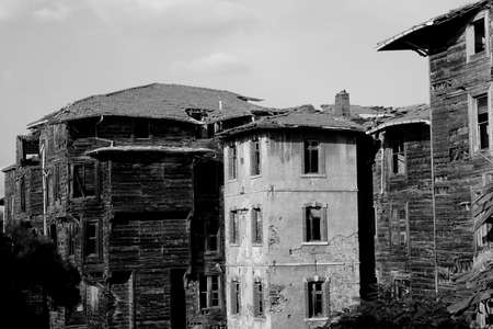 Old destroyed wooden building, black and white photoの写真素材