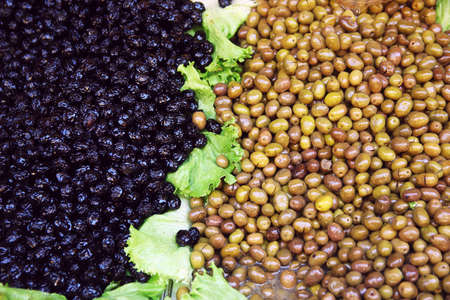 Mediterranean market. Black and green olivesの写真素材
