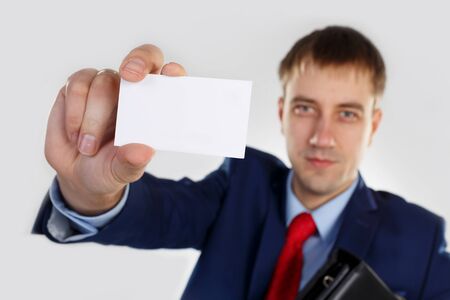 A man with a business card and portfolioの写真素材