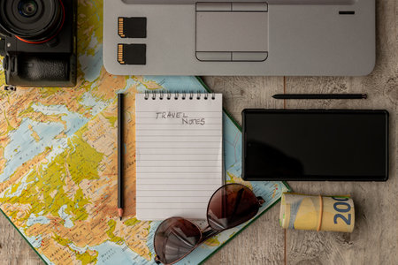 travel planning concept, top view of travel accessories on world map backgroundの写真素材