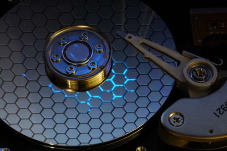 Close up of Computer Hard Drive Disc with abstract colors reflected on the disk surface. Background...