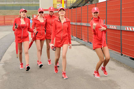 MUGELLO, IT, November, 2011: Unidentified Pit Babe poses for photos in the paddock During Ferrari World Finals 2011 at the Mugello Circuit in Italyのeditorial素材