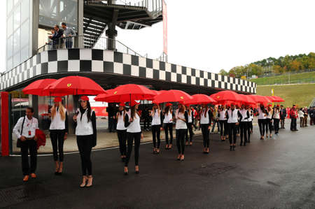 MUGELLO, IT, November, 2011: Unidentified Pit Babe poses for photos in the paddock During Ferrari World Finals 2011 at the Mugello Circuit in Italyのeditorial素材