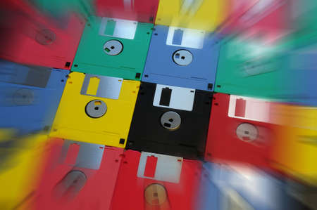 Multicolored floppy disk 3.5 for old computers. background.の写真素材