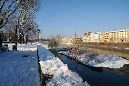 Arno river in winter season, Florence with snow, Italy.の写真素材