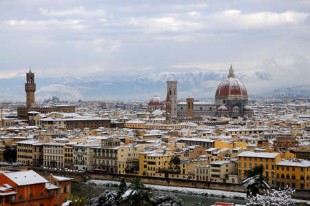 Cathedral of Santa Maria del Fiore (Duomo) and giottos bell tower (bell tower), in winter with snow, Florence, Tuscany, Italyの写真素材