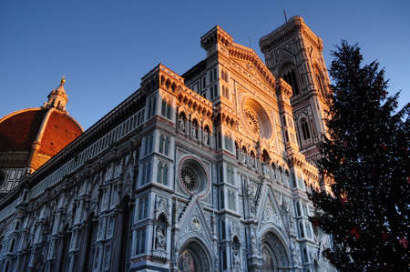 Christmas in Florence. Christmas tree in Piazza del Duomo with Cathedral Santa Maria del Fiore on...