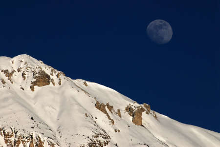 Blue sky with moon on the Dolomites Mountains. Val Badia, Italyの写真素材