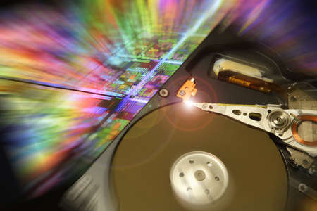 Close Up of Open Hard Disk Drive over future colored background.の写真素材