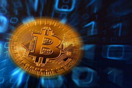 closeup of phisical bitcoin over abstract binary background.