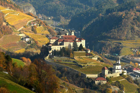 The Monastery of Sabiona near Bolzano, as seen from Villandro. South Tyrol, Italy.の写真素材