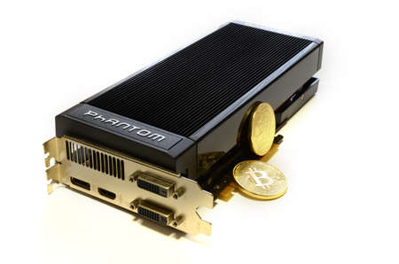 Florence, Italy - March 16, 2018: Cryptocurrency Phisical Gold Bitcoin and modern GAINWARD Nvidia...