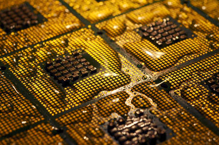 closeup of aligned cpu chips with water drops over