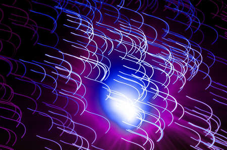blue and purple abstract background with light trails. long exposure effects.