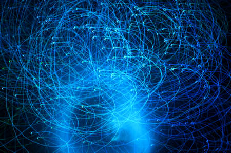Abstract blue color light trails with long exposure at night. Light painting with circle effect.の写真素材