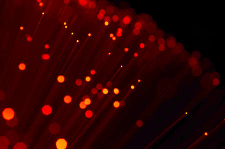 red colored optical fibers. abstract background. soft selective focusing with bokeh.の写真素材