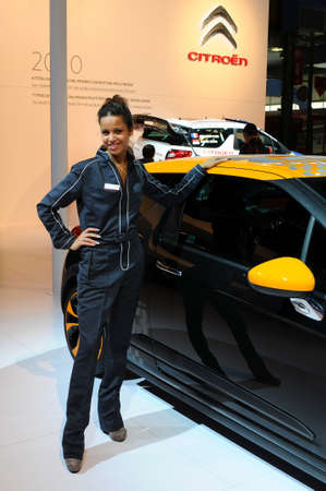 BOLOGNA, ITALY - DECEMBER 2, 2010: beautiful young model poses at Citroen Stand at the Bologna Motor...