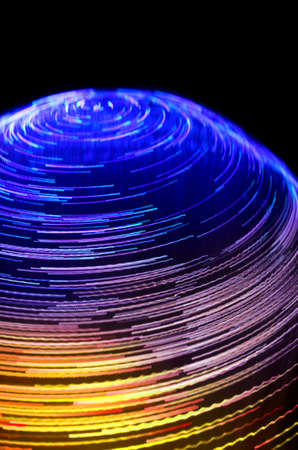 colored vortex effect created by fiber light source. abstract backgroundの写真素材
