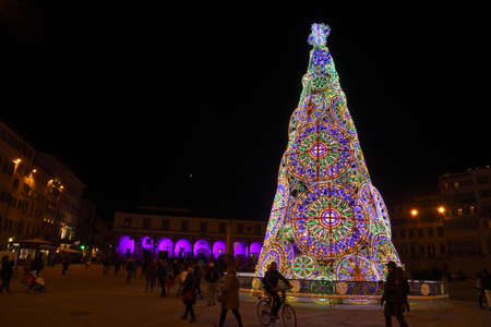 Florence, December 2018: Illuminated Christmas Tree in the Piazza Santa Maria Novella in Florence, on the occasion of the F-Light, Festival of Lights, during the Christmas season 2018. Italyのeditorial素材