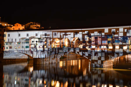 Italy, Florence, December 2018: The famous Ponte Vecchio of Florence illuminated in the occasion of F-Light - Festival of Lights during the Christmas season.のeditorial素材