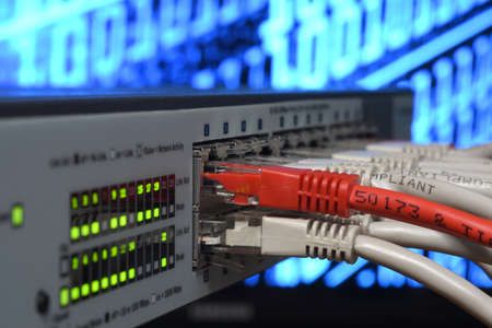 Detail of RJ45 Lan Cables and lights on network switches. Macro Shot