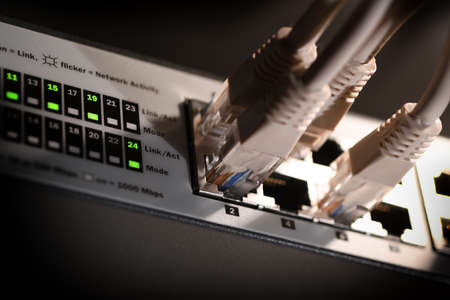Detail of RJ45 Lan Cables and lights on network switches. Macro Shotの写真素材