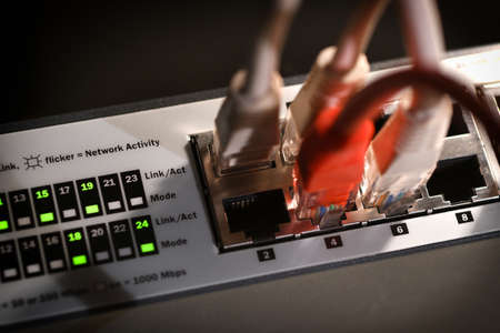 Detail of RJ45 Lan Cables and lights on network switches. Macro Shotの写真素材