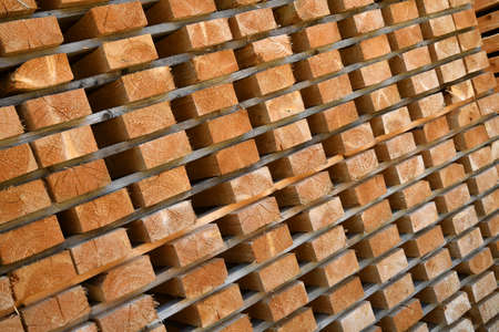 detail of worked wooden boards stacked in a sawmill near Brunico. south tyrol, italy.