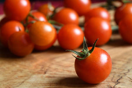 closeup of fresh tomatoes on wooden backgroundの写真素材