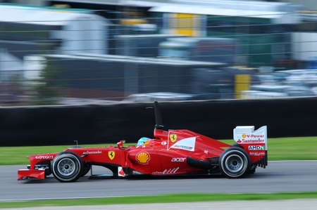 MUGELLO, ITALY 2012: Fernando Alonso of Ferrari F1 team racing in action during Formula One Teams Test Days at Mugello Circuit in Italy.のeditorial素材
