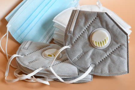 Surgical mask with KN95 or N95 mask for protection pm 2.5 and corona virus. Prevention of the spread of virus and pandemic COVID-19.の写真素材