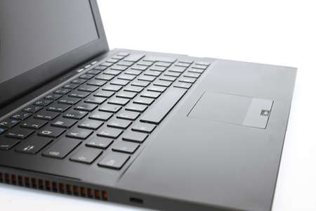 close up on notebook keyboard on white background