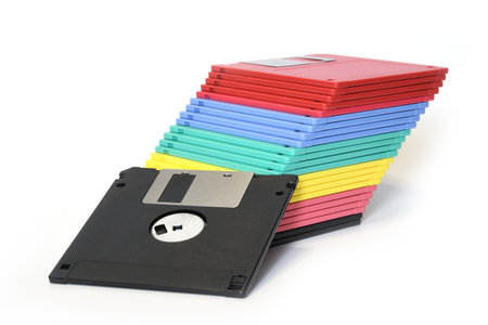 old floppy diskettes isolated on whiteの写真素材