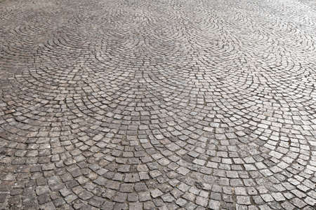 detail of the pavement in porphyry stone. cobblestones pavingの写真素材