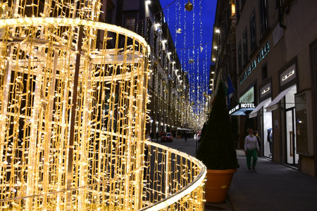 Florence, 22 November 2021: Illuminated Christmas Tree and decoration in the center of Florence. Via Tornabuoni, the fashion street in the historic center of Florence. Italy.のeditorial素材