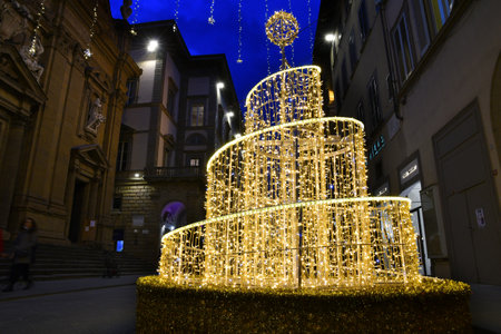 Florence, 22 November 2021: Illuminated Christmas Tree and decoration in the center of Florence. Via Tornabuoni, the fashion street in the historic center of Florence. Italy.のeditorial素材
