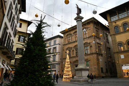 Florence, 22 November 2021: Illuminated Christmas Tree and decoration in the center of Florence. Via Tornabuoni, the fashion street in the historic center of Florence. Italy.のeditorial素材