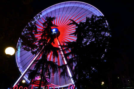 Florence, December 2021: Christmas holidays. Illuminated ferris wheel in the Christmas Park located near the Fortezza da Basso. Italy.のeditorial素材