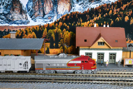 Florence, ITALY - December 2021: Miniature railway model with trains. Mountains ambientation.のeditorial素材