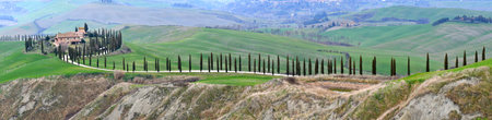 Asciano, Italy - March 2022: Beautiful Tuscan landscape in val d'Arbia. Green hills and Cypresses trees in Tuscany, near Asciano (Siena). Italy.のeditorial素材
