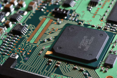 closeup on electronic circuit board with components and semiconductors