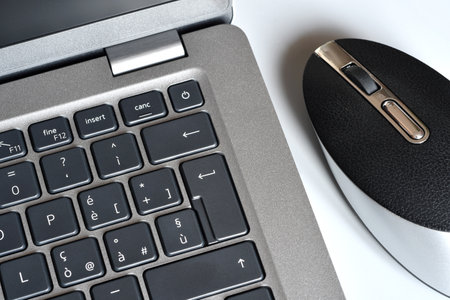 laptop and mouse on table