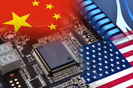 Microchip on a motherboard with Flag of China and USA. Concept for the battle of global microchip production.の写真素材