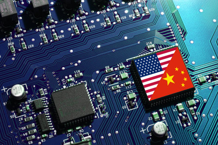 Flag of the Republic of China and the United States on microchip of a PC Motherboard. Concept for world supremacy in microchip and semiconductor manufacturing.の写真素材