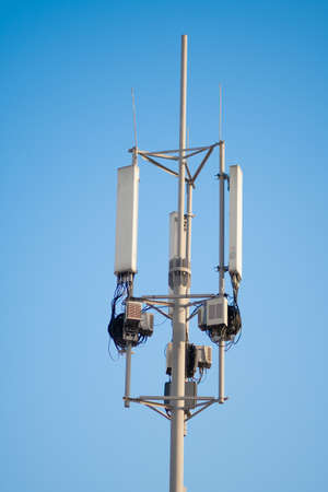 A cell tower against a blue sky. Wireless communication, mobile communication