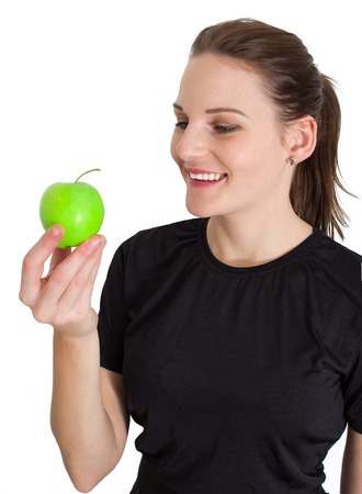 Woman Holding A Green Apple And Smilingの写真素材